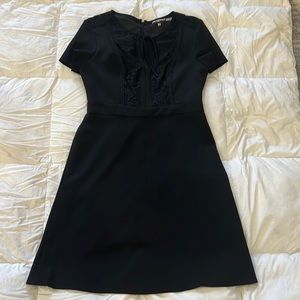 Black fitted dress.